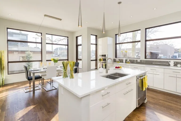 Bright modern kitchen with island and full-height cabinetry for a Johor home
