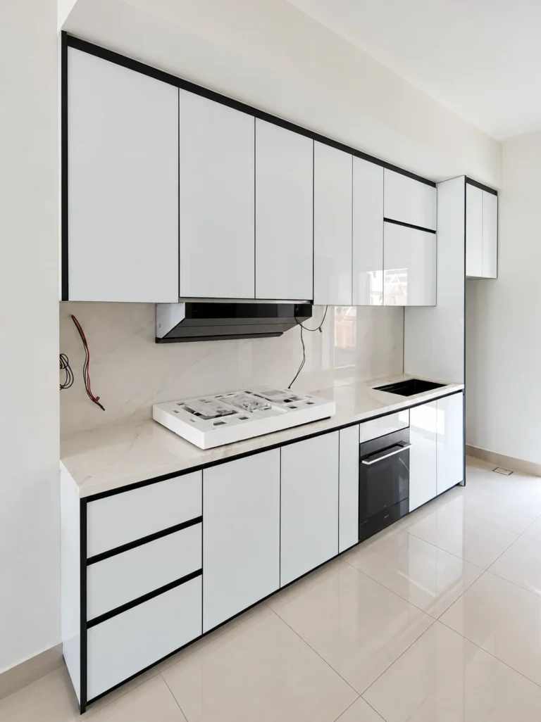 White Kitchen Cabinets With Black Trim, Built-In Oven And Range Hood.