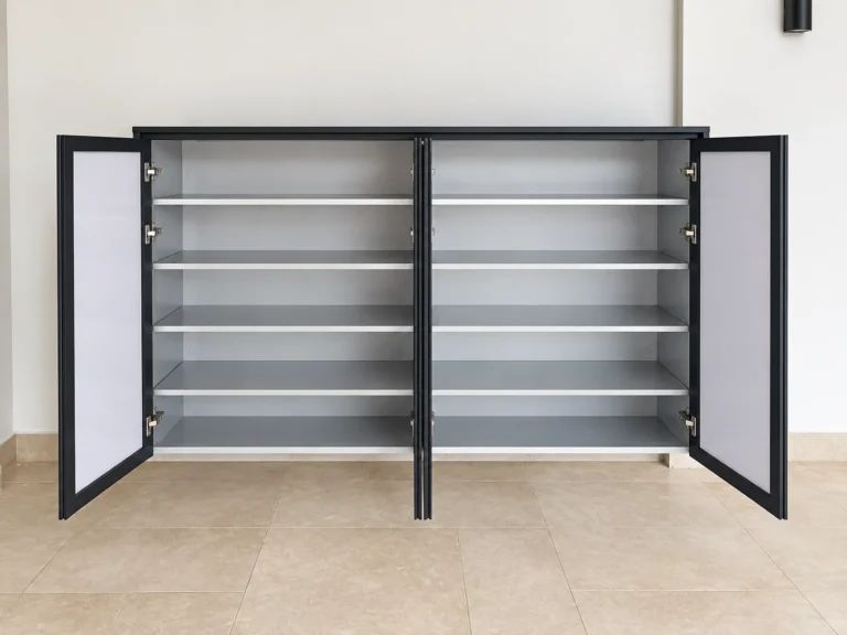 Open Grey Shoe Cabinet Showing Metal Shelves And Dark-Framed Doors.