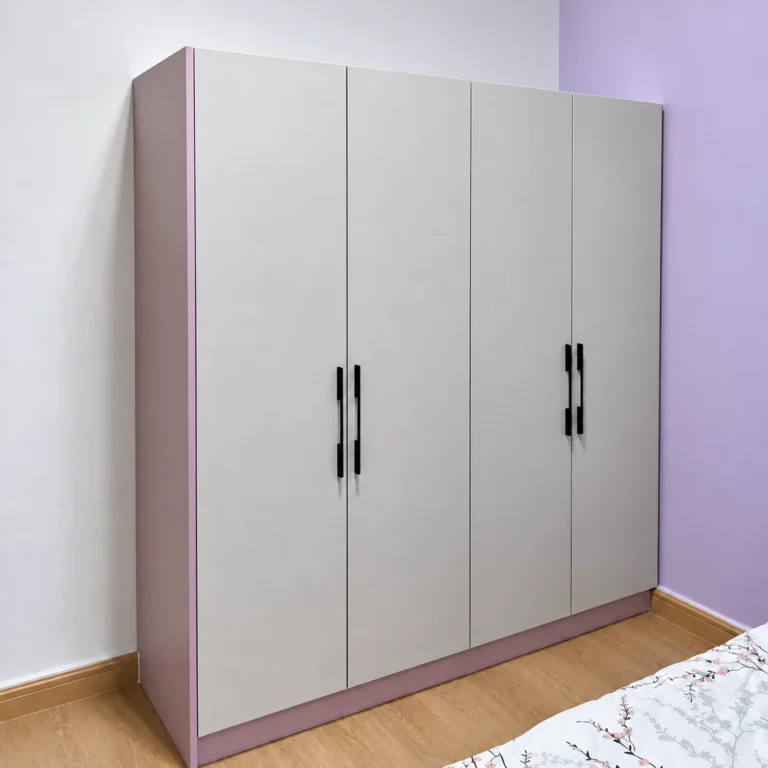 Light Grey Four-Door Wardrobe With Black Handles In A Lavender Bedroom.